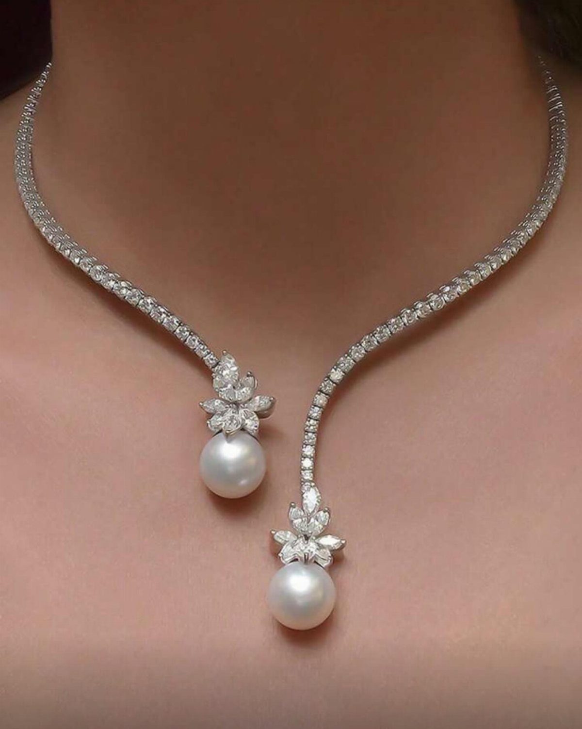 Diamond necklace with two dangling floral accents and white pearls on a neck