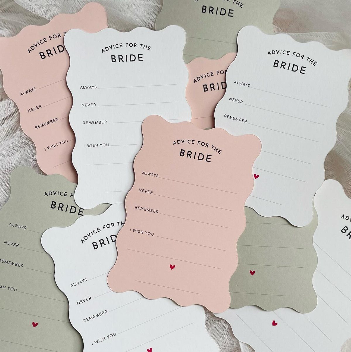 Advice for the bride cards in pink, white, and sage green colors.
