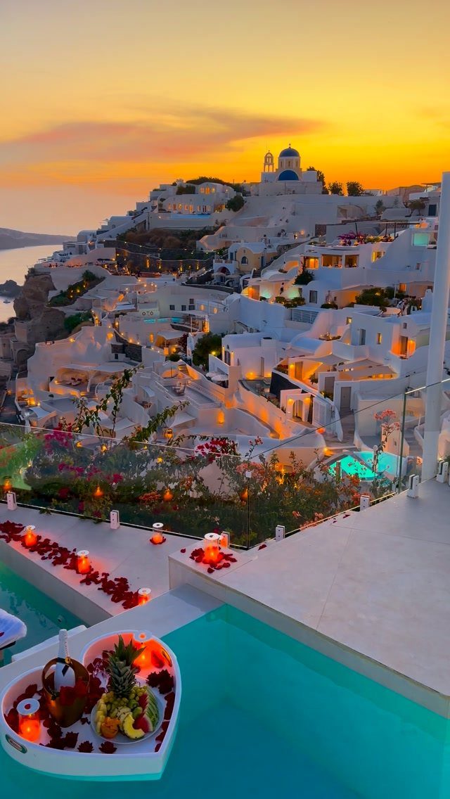 Luxury Santorini rooftop terrace with plunge pool and floating breakfast at sunset