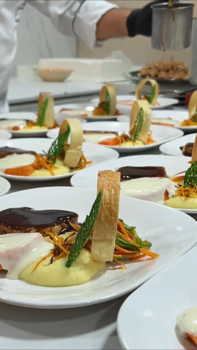 Gourmet plated meals with glazed protein and puree prepared by a chef