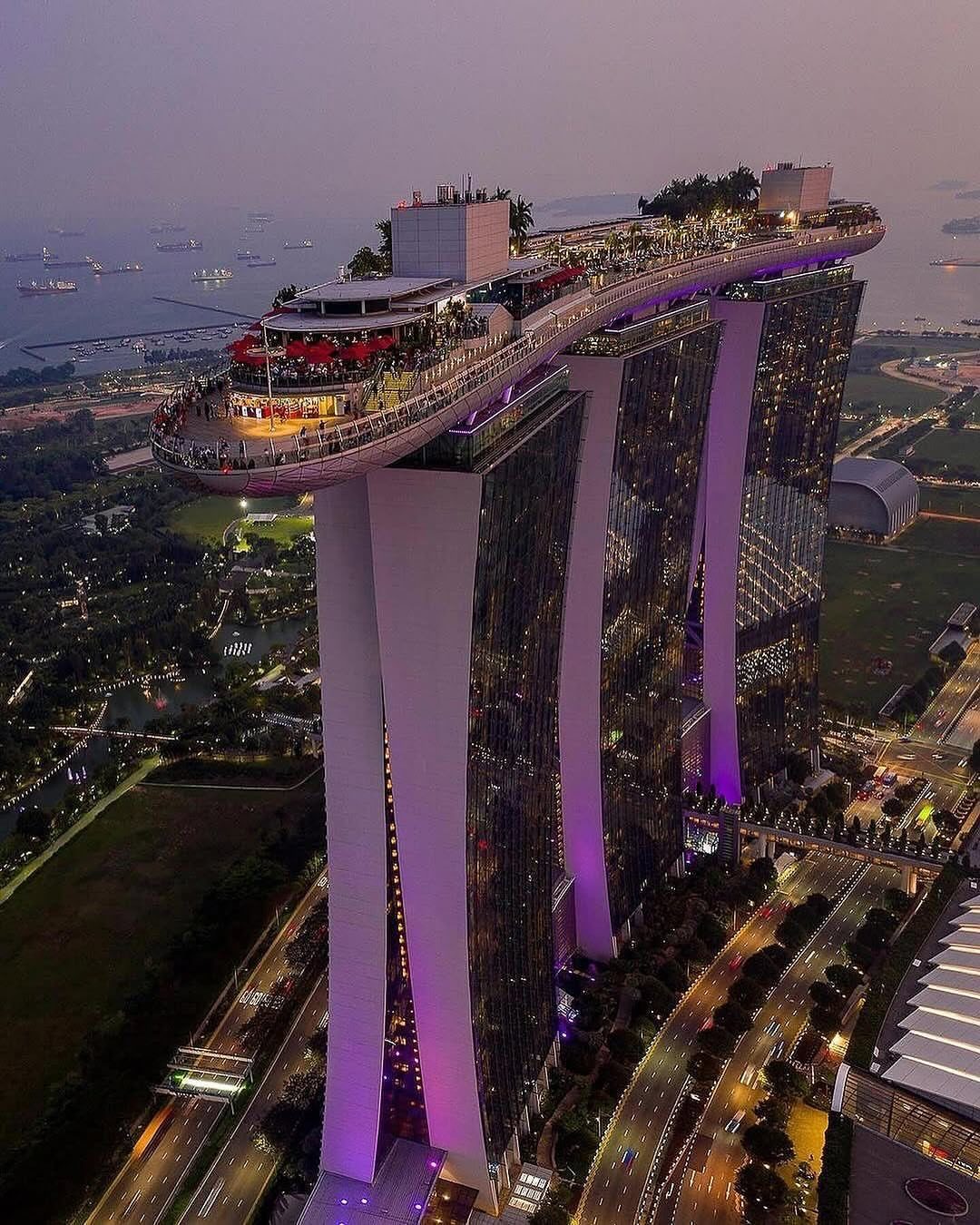 Marina Bay Sands hotel with its iconic rooftop terrace overlooking Singapore city skyline