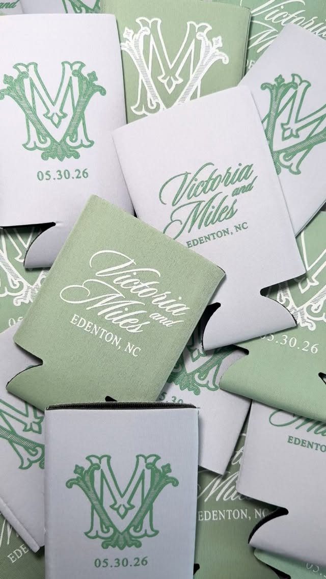 Sage green and white customized beverage koozies with wedding names and dates.