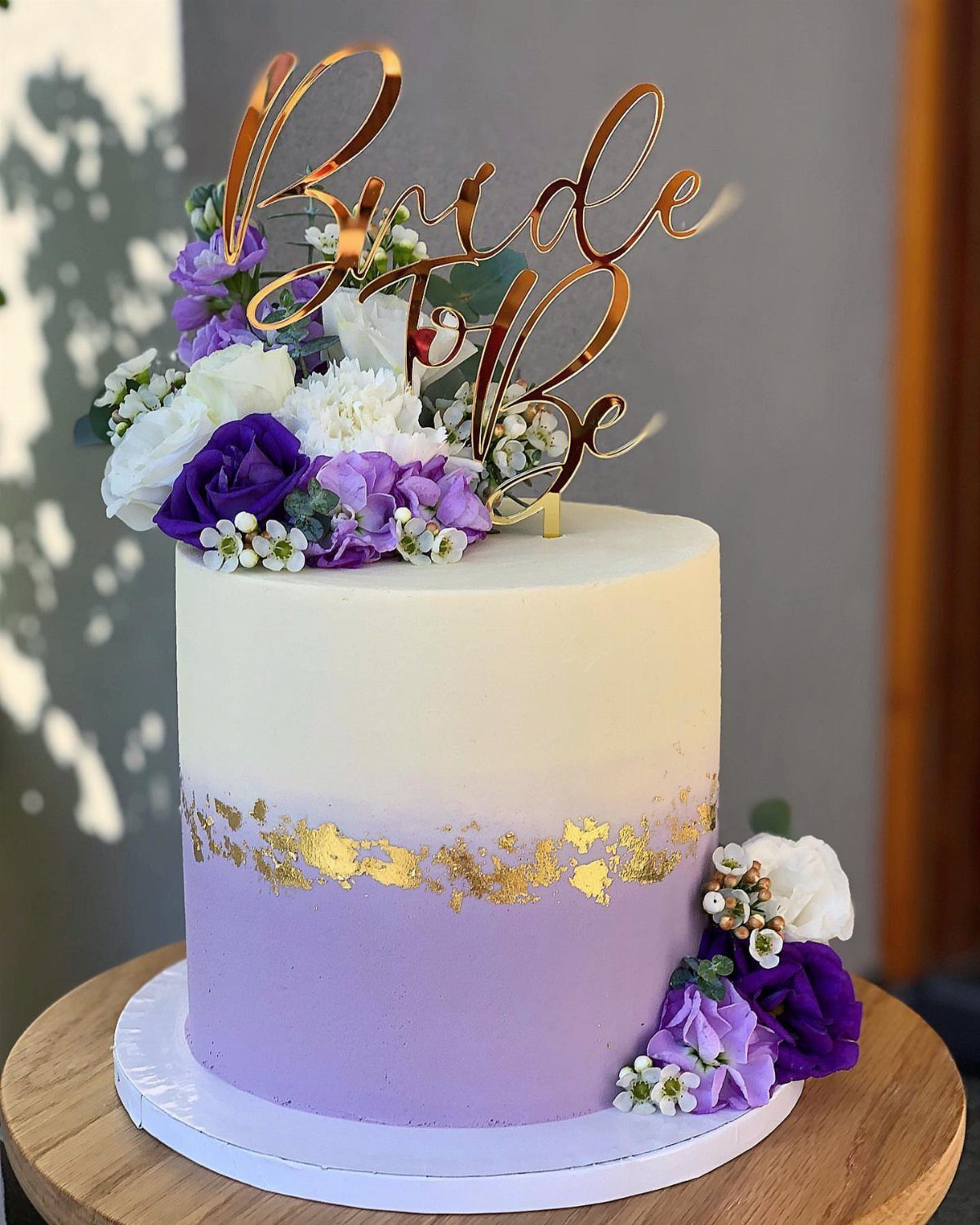 Gradient white and purple cake with gold leaf and Bride to Be topper